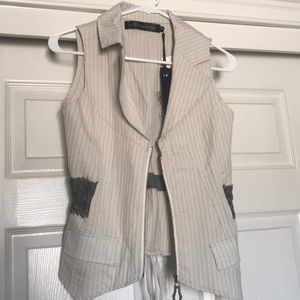 Brand new vest that ties in back